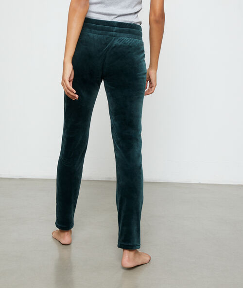 Pantalon effet velours vert.