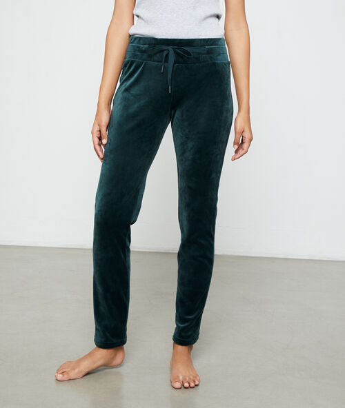 Pantalon effet velours vert.